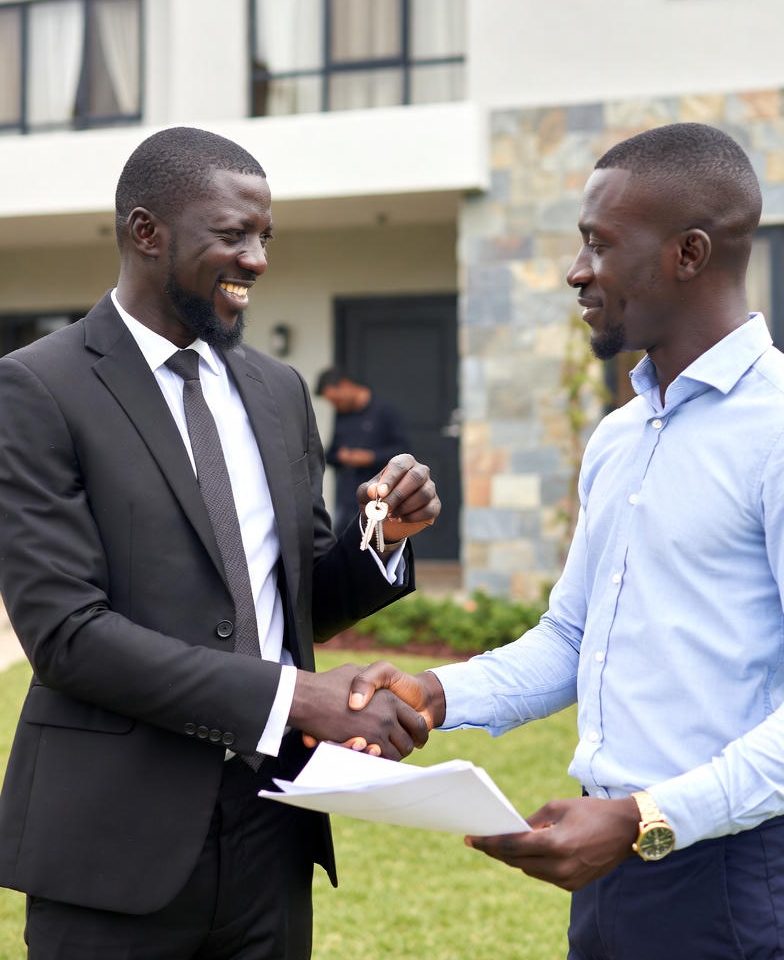 Happy African client with real estate agent